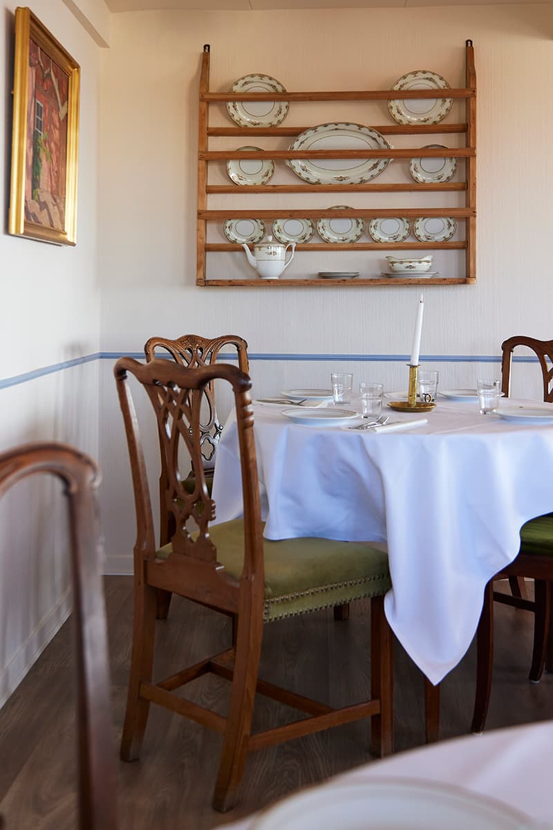 Breakfast at Kysten Restaurant Bornholm with tables cloths and antique furniture