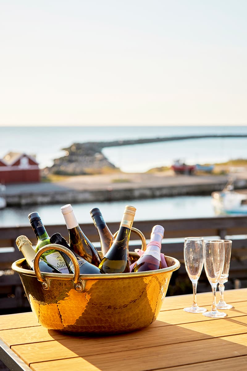 Bottles in cooler on terrace overlooking the sea